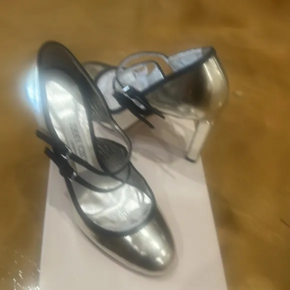 Jimmy Choo stunning silver with black bands, never worn.