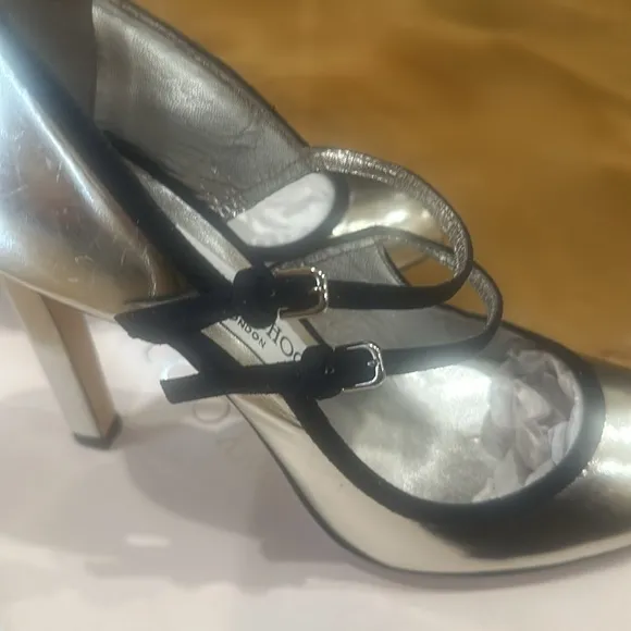 Jimmy Choo stunning silver with black bands, never worn.