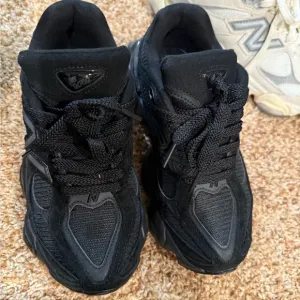 New Balance Black and White Athletic Shoes
