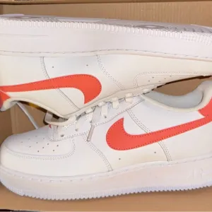 Nike Air Force 1 White and Orange Athletic Shoes