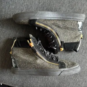 Stylish Black and Gold High-Top Sneakers