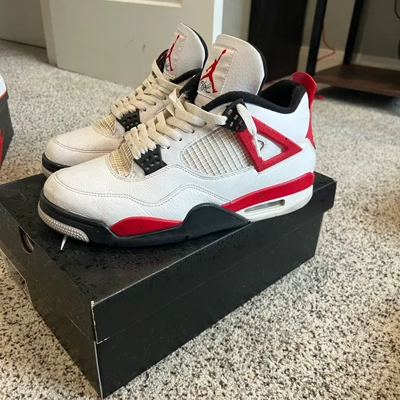 White and Red air Jordan 4s.