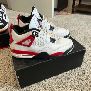 White and Red air Jordan 4s.